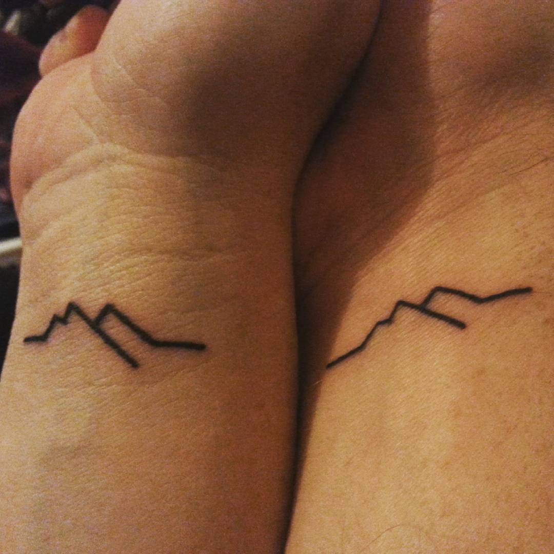 Lori's and my matching mountain tattoos